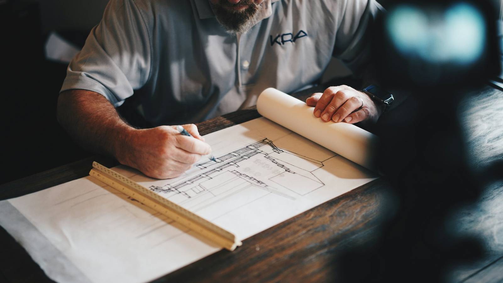 Builder marking up construction drawings